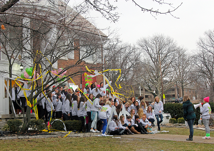 Women of Alpha Phi Rho chapter, a women’s fraternity, pose for photos with new members on Bid Day Jan. 20 at the chapter’s house, located at 134 E. 15th Ave. Sororities and fraternities will be required to follow certain policies to participate in OSU’s second-year living program. Credit: Shelby Lum / Photo editor