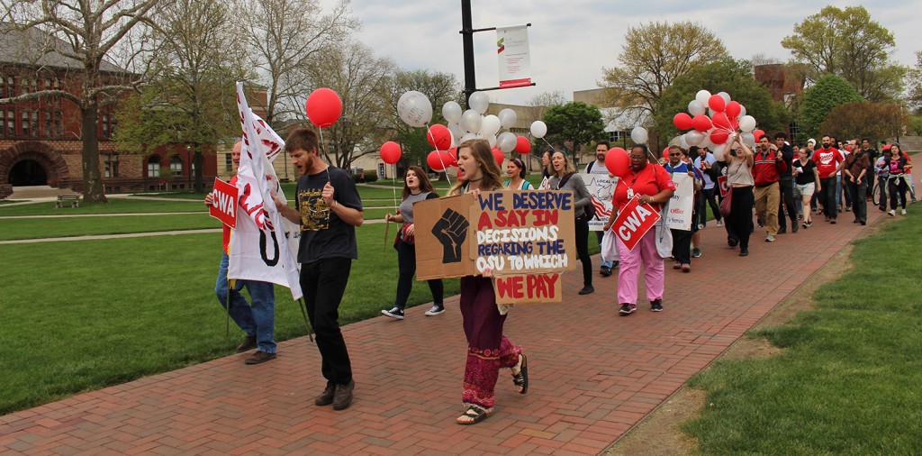 Protesters met at the South Oval to march to Bricker Hall to voice conerns with the Comprehensive Energy Management Plan on April 21. Credit: Hannah Herner | Assistant Arts&Life Editor