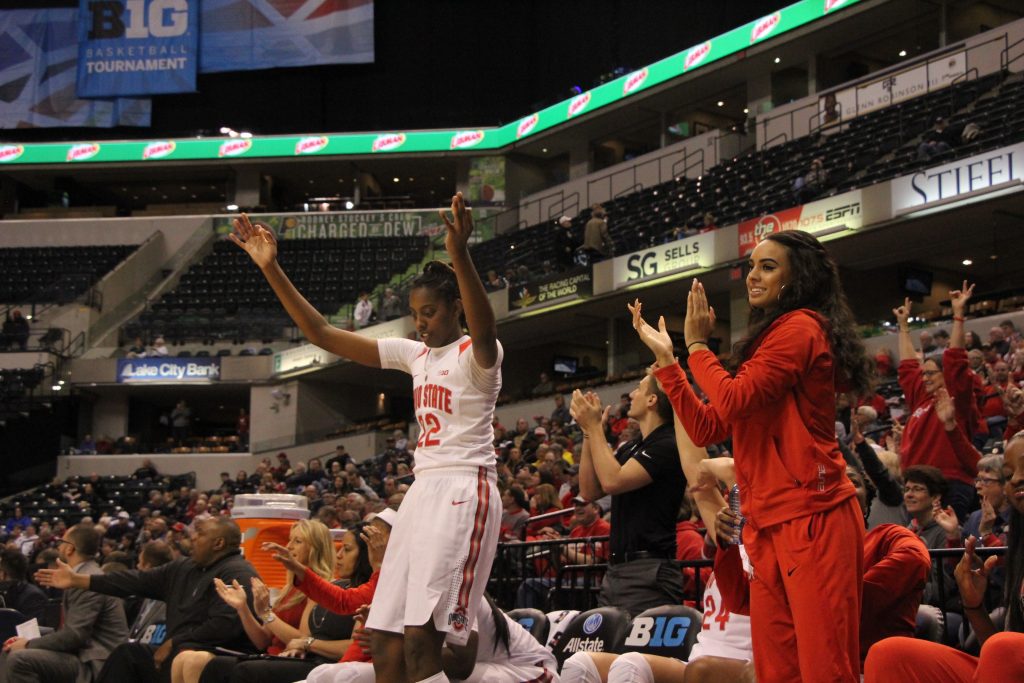 OSU junior forward Alexa Hart (22) and redshirt junior guard Kianna Holland (right) cheer a teammates' basket on March 3 at the Bankers Life Fieldhouse in Indianapolis. Credit: Ashley Nelson | Sports Director 
