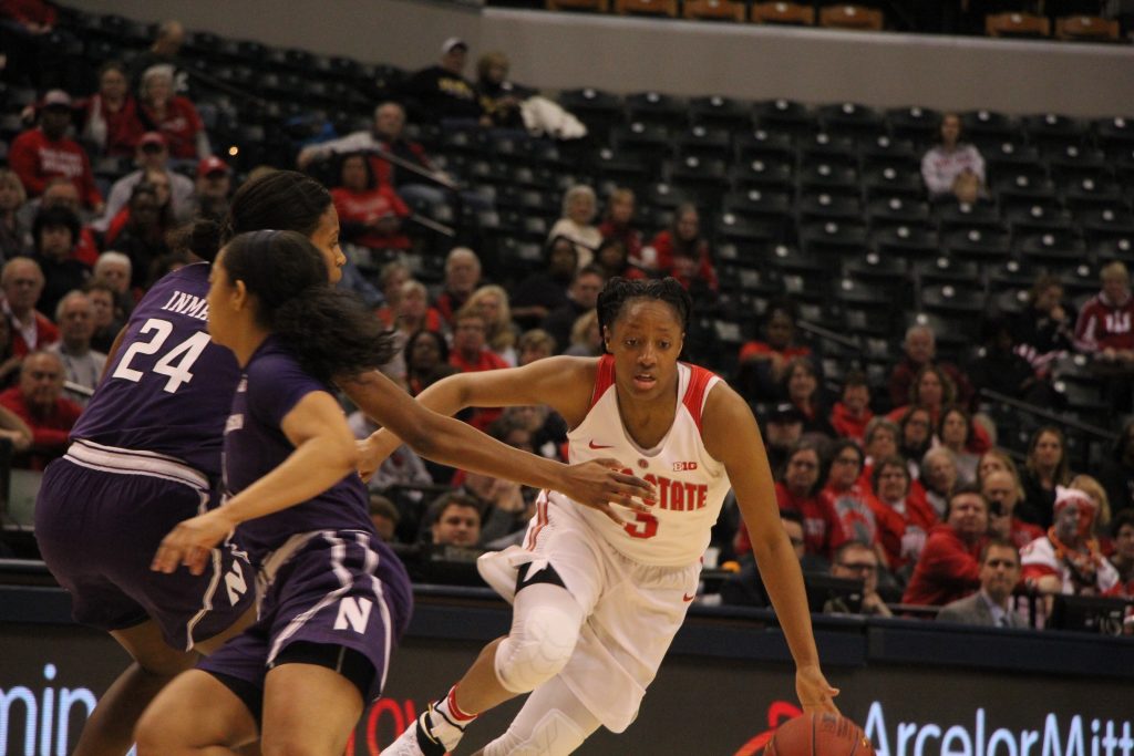 OSU junior guard Kelsey Mitchell dribbles around senior guard Christen Inman of Northwestern on March 3 during the Big Ten tournament in Bankers Life Fieldhouse in Indianapolis. OSU won, 99-68. Credit: Ashley Nelson | Sports Director