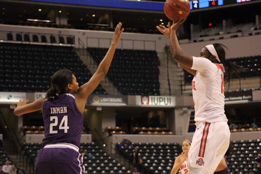 OSU junior guard Linae Harper puts up a shot over Northwestern senior guard Christen Inman on March 3 in Indianapolis. OSU won, 99-68, in Bankers Life Fieldhouse.