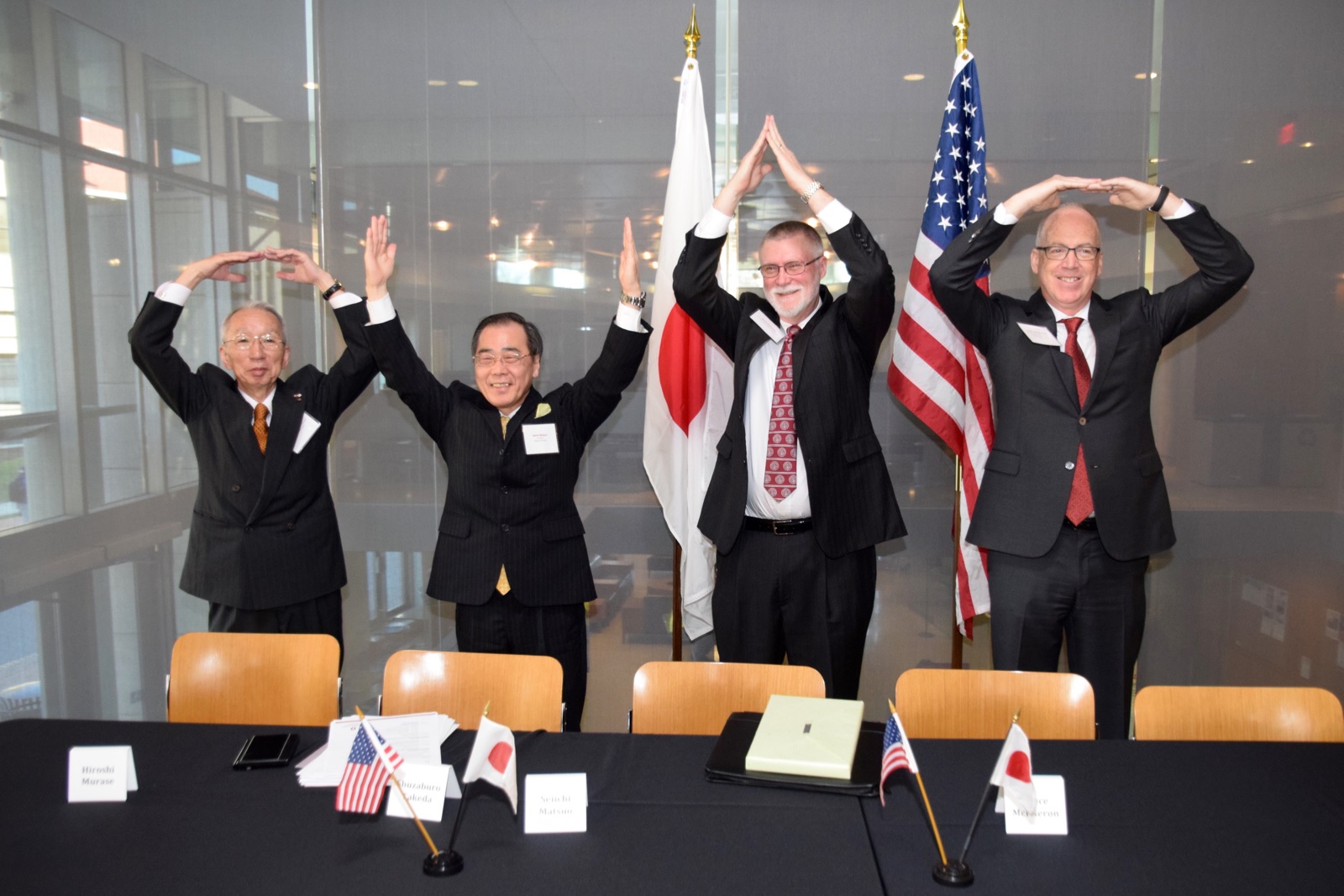 Shuzaburo Takeda, Seiichi Matsuo, Bruce McPheron, and David Manderscheid signing ceremony of the agreement at Thomson Library, March 9. Credit: courtesy of Victor van Buchem