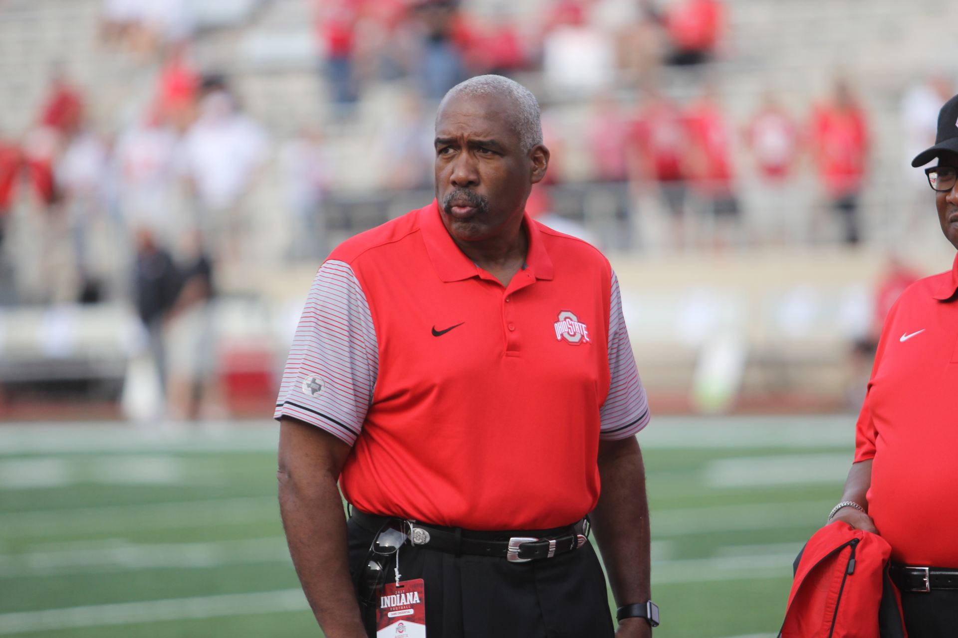 Gene Smith walks on the field at Ohio Stadium before a game