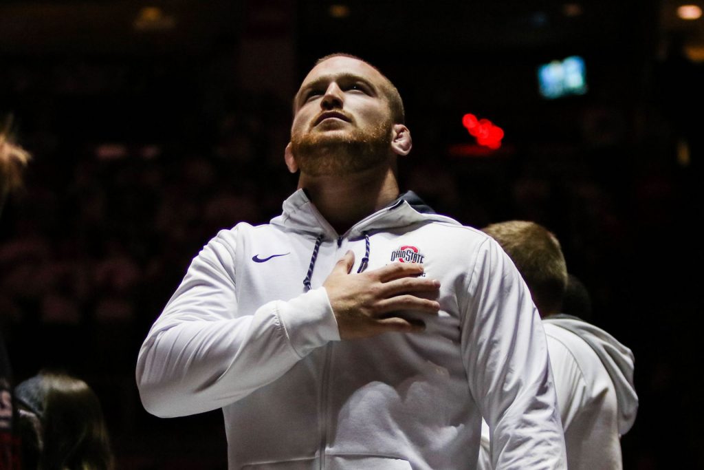 Ohio State's Kyle Snyder stands during the national anthem prior to the the dual-meet against Iowa on Jan. 21 in the Schottenstein Center. Credit: Jack Westerheide | Photo Editor