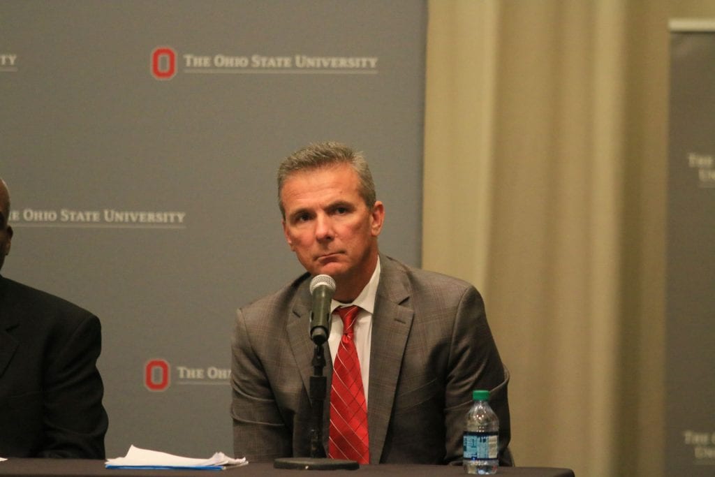 Urban Meyer listens at a press conference as he fields questions about his handling of the Zach Smith domestic abuse allegations on Aug. 22, 2018. Credit: Casey Cascaldo | Photo Editor
