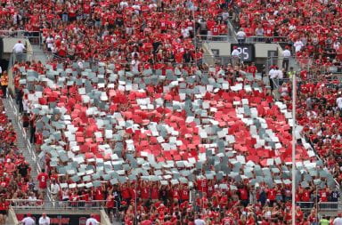 Students in Block O hold up posters to spell “150” in honor of Ohio State’s sesquicentennial in the first half of the game against Cincinnati.