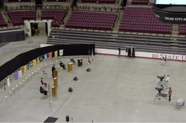 The speakers for the 2020 summer virtual commencement stand at podiums spaced out throughout the Schottenstein Center as the ceremony is live streamed.