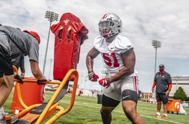Junior linebacker Trayvon Wilburn engages with a blocking sled in an Ohio State practice