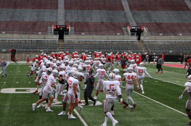 Ohio State football players warming up ahead of practice.
