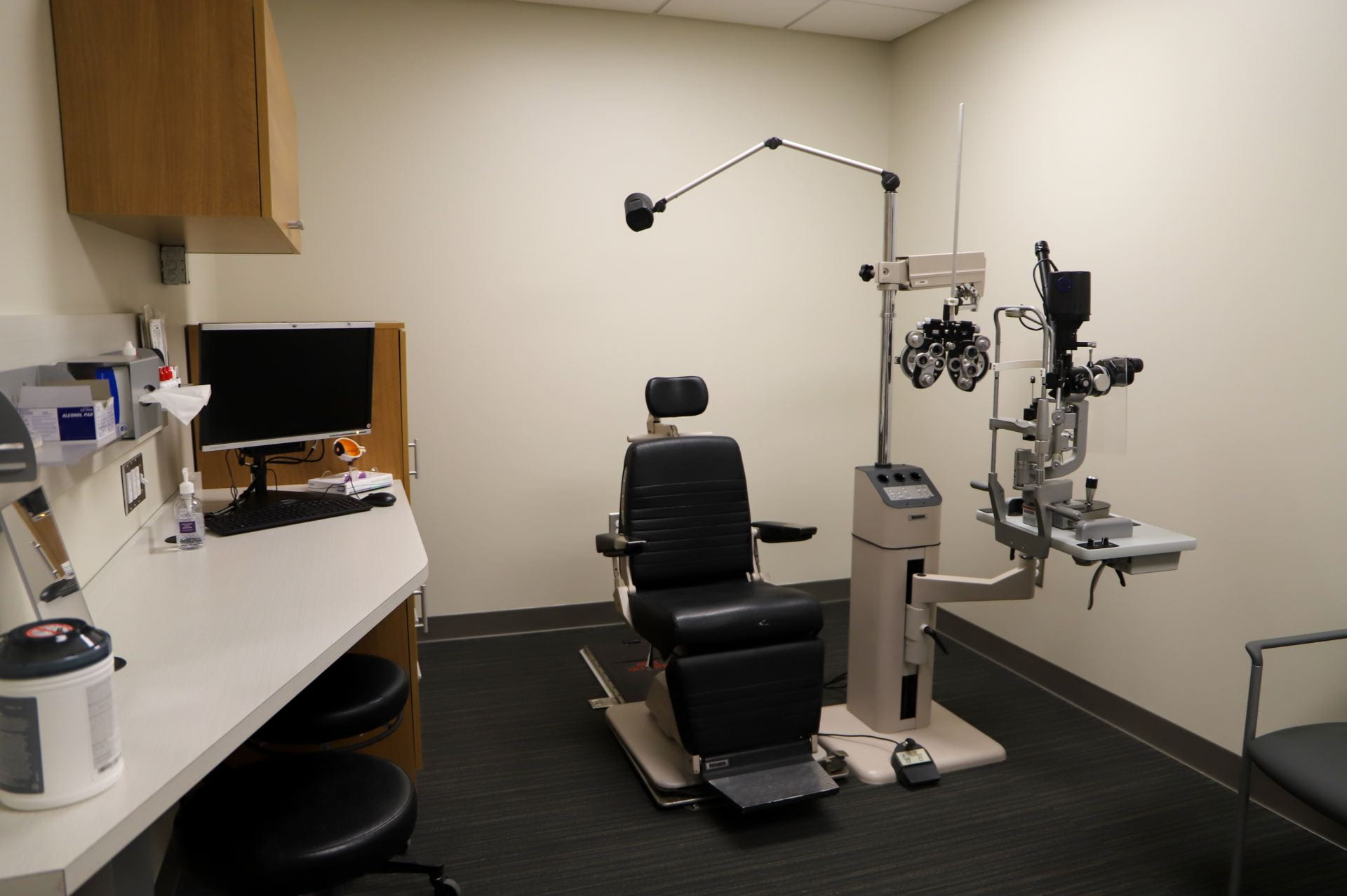 an exam room in the optometry clinic with a chair and equipment
