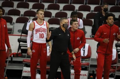 Chris Holtmann watches the game from the sideline