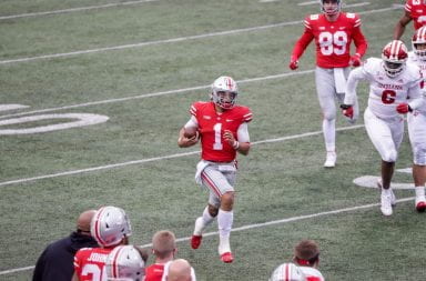 Justin Fields carries the ball down field