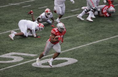Master Teague carries the ball against the Indiana defense