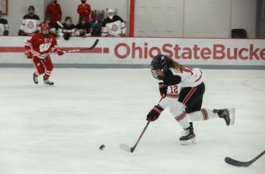 Jennifer Gardiner takes the puck down the ice