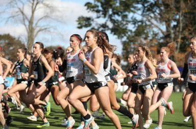 A group of Ohio State cross country runners racing against other Big Ten teams.