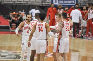 The Ohio State Men's Basketball team huddles up mid game during the Ohio State-Michigan State game Jan 31
