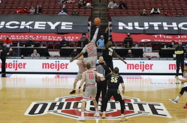 Ohio State's E.J Liddell tips off to start the game