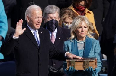 Jill Biden holds an old bible as Joe Biden is sworn in