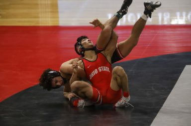 Ohio State junior wrestler Malik Heinselman fends off an opponent during the Ohio State-Rutgers match on Jan. 24.