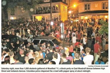 newspaper clipping from 2011 lantern article of hundreds of people in street