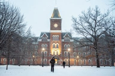 Students walk in front of University Hall in the snow. Credit: Christian Harsa | Senior Lantern Reporter