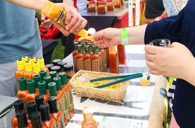 Hot sauce samples are passed out to attendees at the 2022 Fiery Foods Festival, a tradition that will be honored again this year. Credit: Courtesy of Columbus Fiery Foods Festival