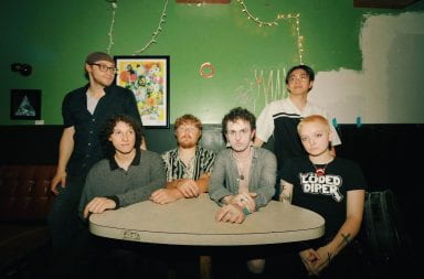 Pictured from left to right are the six members of alternative band Cellar Dwellar, Adi Mars (standing), Nico Linik, Nick Partridge, Kade Weinmann, Jesse Lung (standing) and Jayci Kaufman. Credit: Mick Martinez