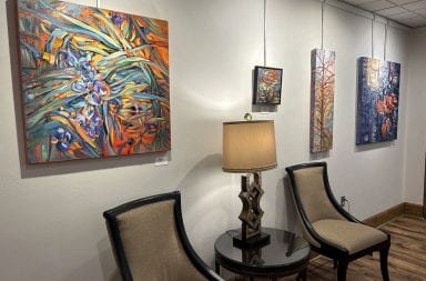 A few of Janet Grissom's "Strokes of Color" art pieces on display at the Ohio State Faculty Club. Credit: Paige McBane | Lantern Reporter