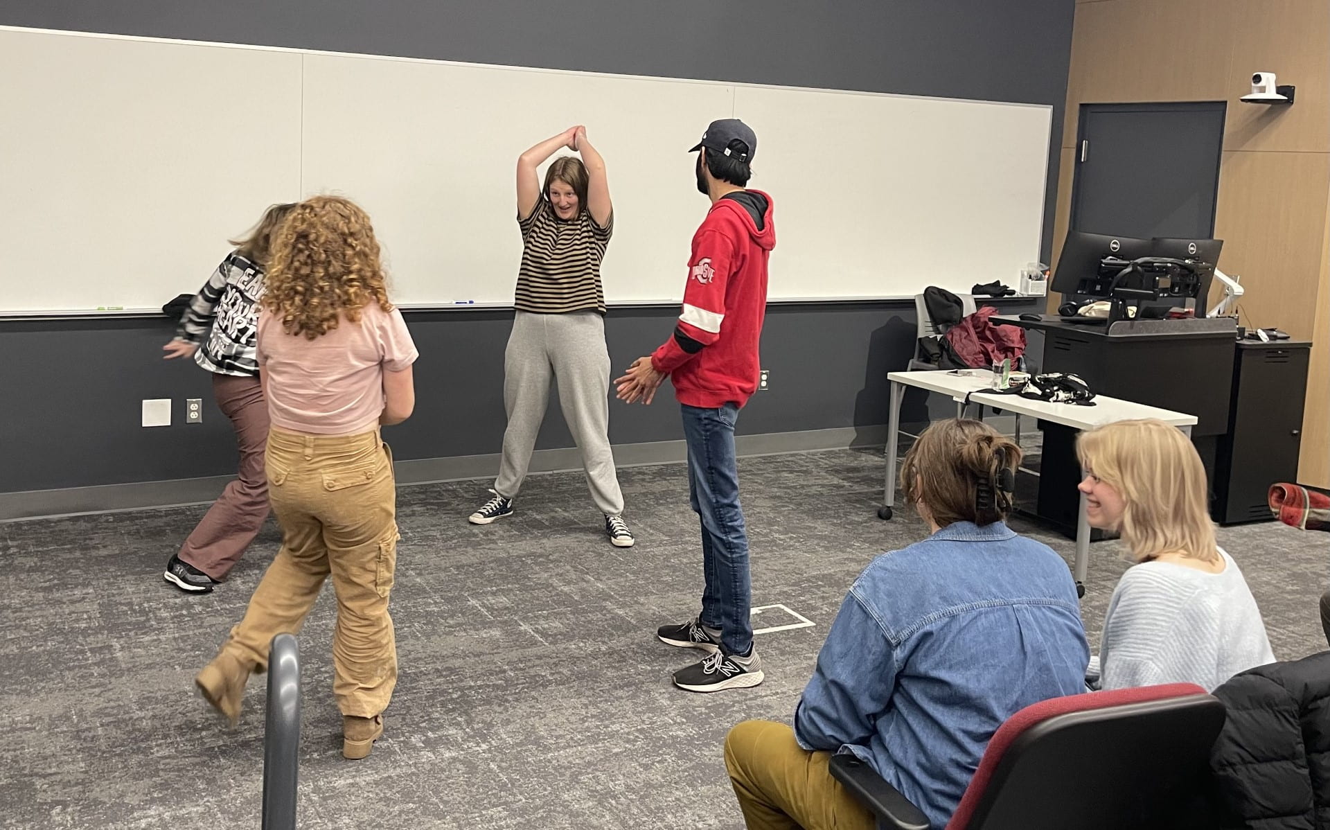 Members of Fishbowl Improvisational Comedy Group warm up before a practice for the upcoming Tides Improv Comedy Festival, which will take place this weekend in the Ohio Union's U.S. Bank Conference Theater. Credit: Avery Caudill | Lantern Reporter