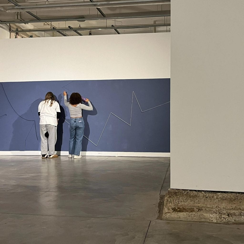Another installation of "Grieving Landscapes," titled “The Gathering,” involves attaching messages on a string to the Urban Arts Space gallery wall. Credit: Nico Lawson