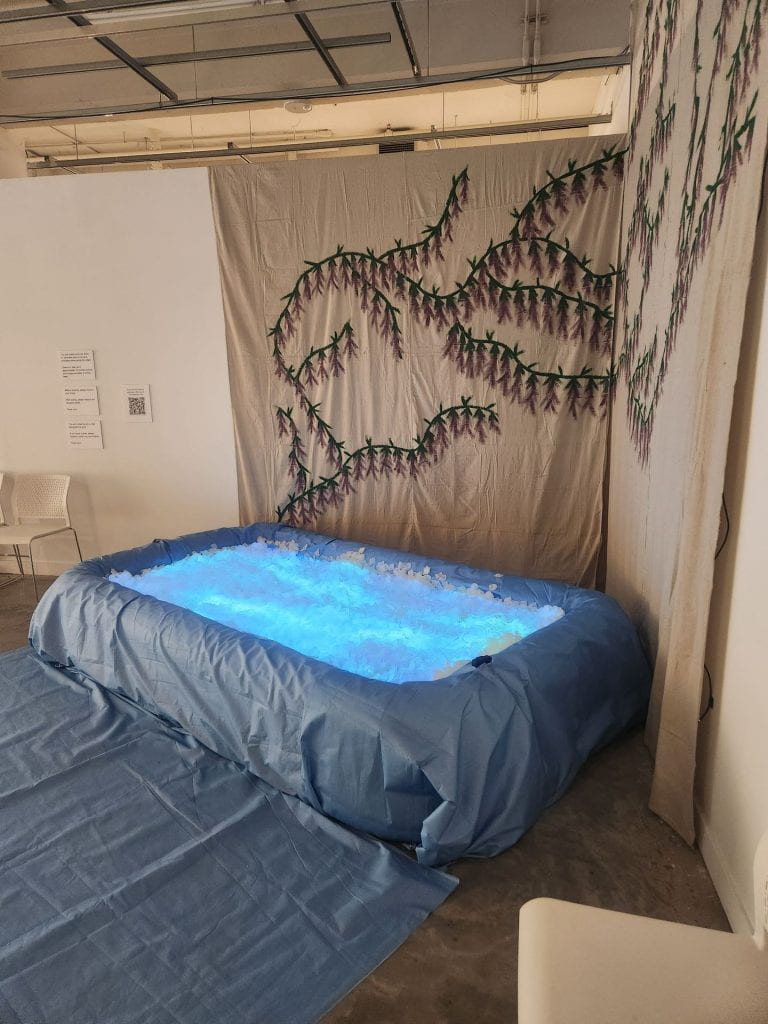 The “Reflection Pool,” a set piece for one of the acts in "Grieving Landscapes," a performance installation in the Urban Arts Space exploring grief through dance. Audience members are encouraged to sit in the pool and meditate. Credit: Nico Lawson