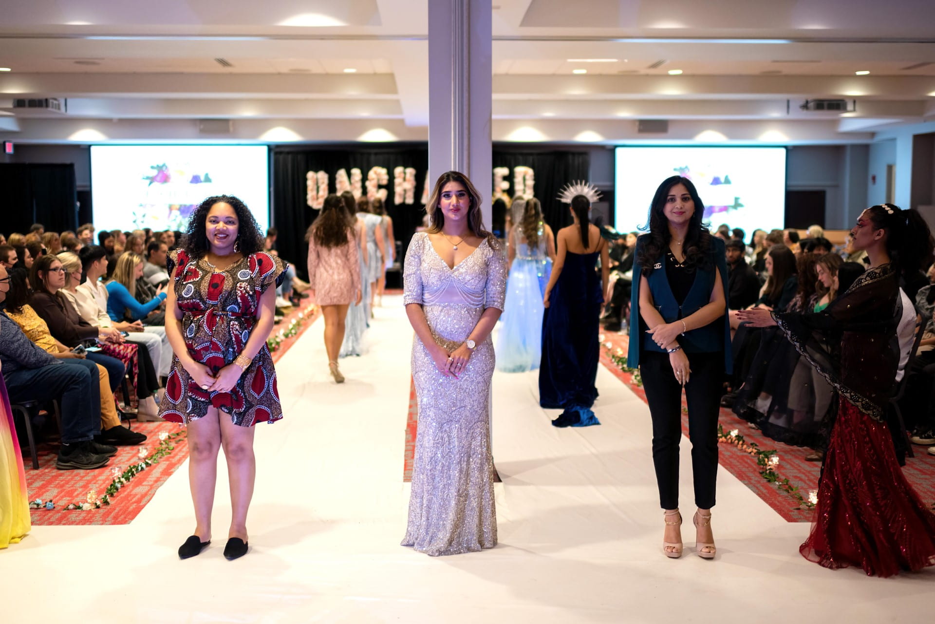 Designers Destiny Howards (left), Amrita Chehil (middle) and Anjali Phougat (right) take the runway alongside their designs at the 2023 Unchained OSU fashion show. Credit | Dave Toth
