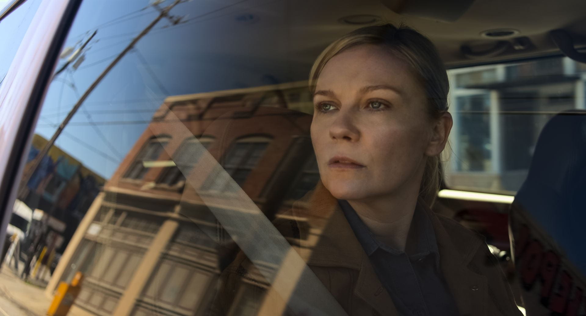 In the near future, a war photographer (Kirsten Dunst) witnesses a nation on the brink in "Civil War." Credit: A24 (via. TNS)