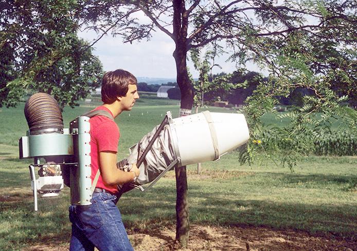Daniel Herms, OSU entomology department chair, D-Vac sampling trees as a student. Credit: Courtesy of Julie Gaier