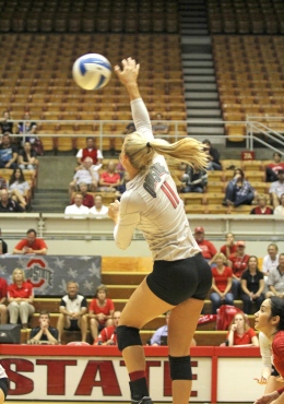 Shelby Lum / Photo editor Senior outside hitter Kaitlyn Leary (11) spikes the ball during a match against Dabrowa Sept. 4, at St. John Arena. OSU won, 3-2.