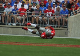 Shelby Lum / Photo editor Junior quarterback, Braxton Miller, falls on the field. The Ohio State football team beat the University of Buffalo, 40-20, Aug. 31 at Ohio Stadium.