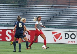Shelby Lum / Photo editor Senior midfielder Kristen Niederhaus avoids a defender during a game against Pittsburgh on Aug. 28, at Jesse Owens Memorial Stadium. OSU won, 2-0.
