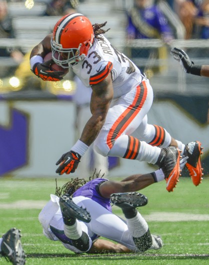 Cleveland Browns running back Trent Richardson hurdles Baltimore Ravens cornerback Lardarius Webb on a run from scrimmage during the first half of their game on Sunday, September 15, 2013, in Baltimore, Maryland. (Doug Kapustin/MCT). Credit: Courtesy of MCT