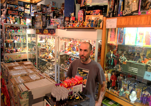 Jason Williams, co owner of Big Fun Toy Store, talks to customers. Big Fun is located at 672 N. High St. Credit: Shelby Lum / Photo editor 
