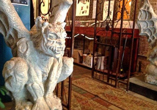 A gargoyle statue sits inside Vinyl Frontier, a record store which was located at 51 E. Gay St. before closing in July. Credit: Courtesy of Justin Crockett 