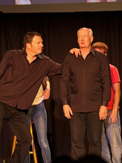 Comedians Brad Sherwood (left), and Colin Mochrie interact with audience members for a game during their show Sept. 16 in the Archie M. Griffin Grand Ballroom. Credit: Shelby Lum / Photo editor