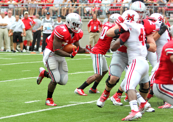 Then-junior running back Carlos Hyde breaks through the line during a game against Miami (Ohio) Sept. 1, 2012 at Ohio Stadium. OSU won, 56-10. Credit: Lantern file photo