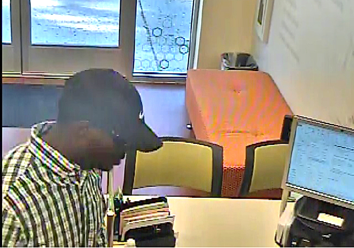 A screenshot from security footage at Huntington National bank located at 235 W. 11th Ave. around 9:25 a.m. Sept. 14. Credit: Courtesy of University Police