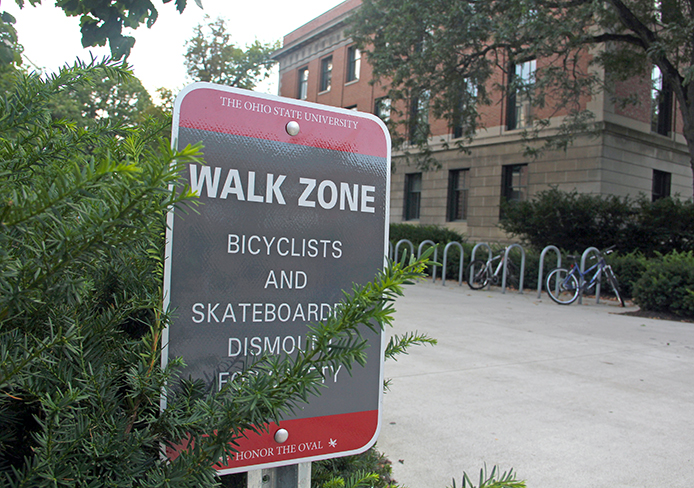 A safety sign outside Derby Hall noting the Walk Zone near the Oval. Credit: Ritika Shah / Asst. photo editor