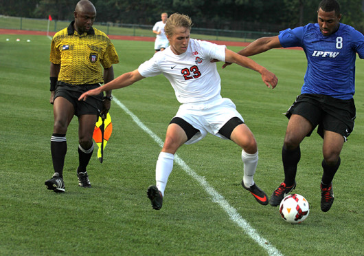  Junior midfielder Ryan Ivancic races his opponent to the ball during a game against IPFW Aug. 20, at Jesse Owens Memorial Stadium. OSU won, 2-0.