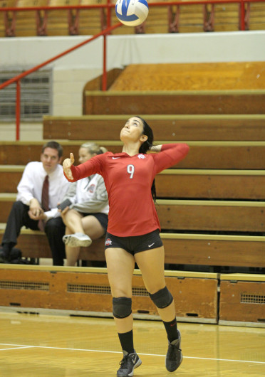 Shelby Lum / Photo editor Freshman defensive specialist Valeria León serves the ball before a match against Dabrowa, Sept. 4 at St. John Arena. OSU won, 3-2.