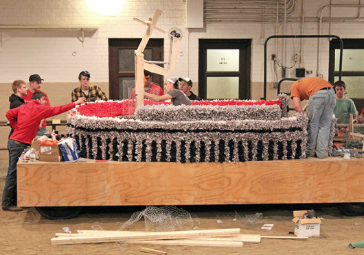 FarmHouse International Fraternity members work on their float for this year's homecoming parade.  Credit: Courtesy of Brent Stammen