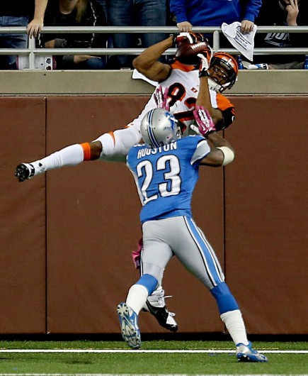 Cincinnati Bengals' Marvin Jones catches a touchdown pass against Detroit Lions' Chris Houston during second-quarter action at Ford Field Sunday, Oct. 20. Credit: Courtesy of MCT