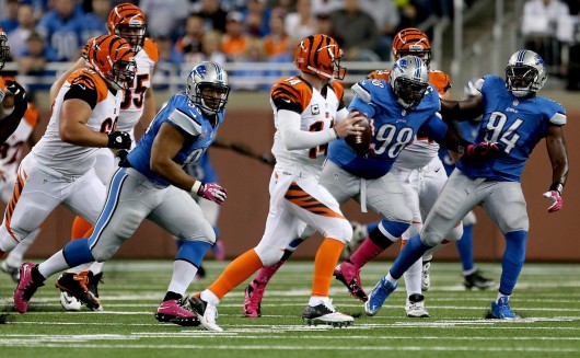 Detroit Lions' Ndamukong Suh, Nick Fairley and Ezekiel Ansah pursue Cincinnati Bengals' Andy Dalton during a game at Ford Field Oct. 20. The Bengals won, 27-24. Credit: Courtesy of MCT