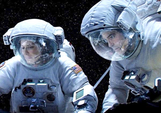 Sandra Bullock (left) and George Clooney in a scene from 'Gravity,' which is set to hit theaters Oct. 4.  Credit: Courtesy of Gofobo